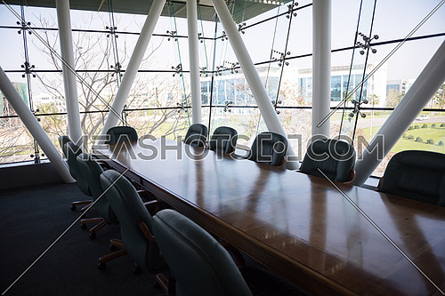 Interior of new modern corporate office meeting room with big glass windows
