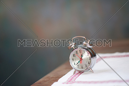 vintage retro old clock at wooden table