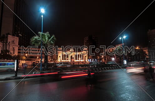 Fixed long shot for traffic towards Alexandria Naval Unknown Soldier Memorial at night