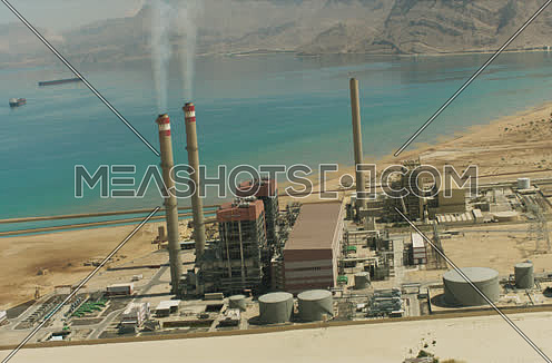 Arial shot 180 degree around a Factory at Suez at day