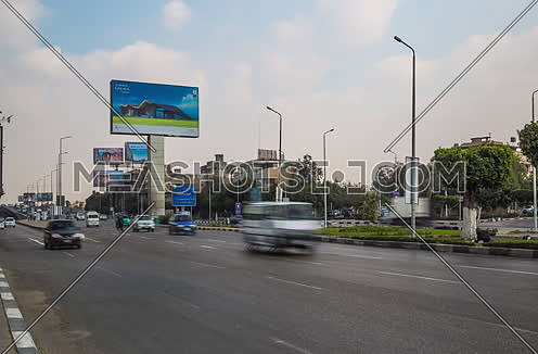 Zoom In Shot for traffic at Salah Salim Street showing AL Galaa Bridge in background at Daytime