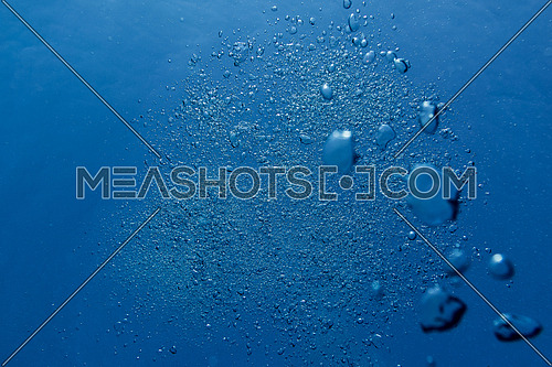 air bubbles in clear blue ocean water