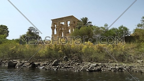 Track shot for Temple of Philae li from the boat in the River Nile at Aswan - Egypt by day