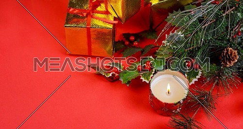 Christmas with gifts and holiday decorations on, red background