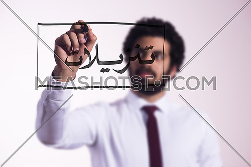 middle eastern business man draw with marker on virtual screen