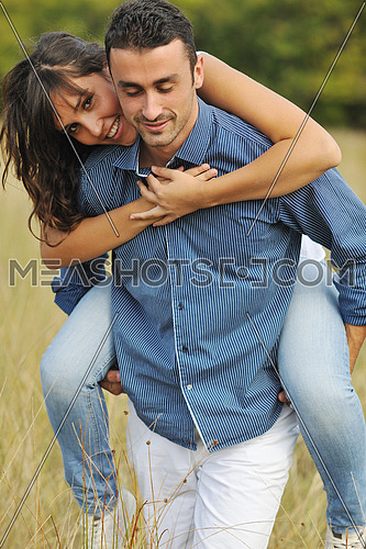 happy young couple have romantic time outdoor while smiling and hug