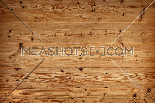 Brown old vintage unpainted wooden horizontal planks wall background texture with aged knotty woodgrain pattern and dark shaded vignette, close up