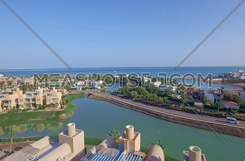 Drone shot flying from Gold Course untill reavels the red sea  and AL Gouna
