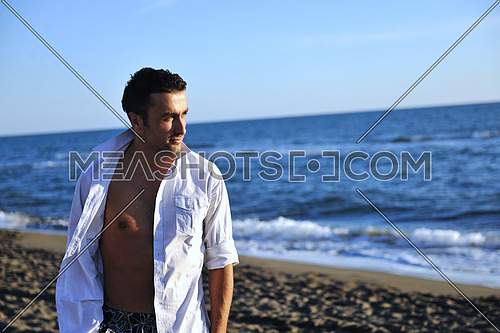 young man have good time and relax at beautifu beach at seaside