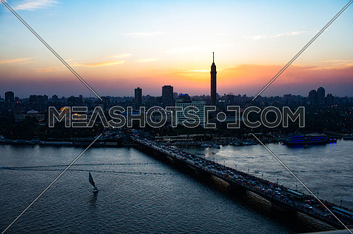 A panoramic view of cairo river nile, qasr el nile bridge and the cairo tower at sunset