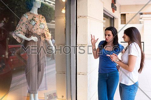 two young ladies shopping in korba area at day