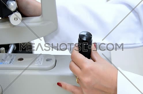 ophthalmologist hand using latest technology machine