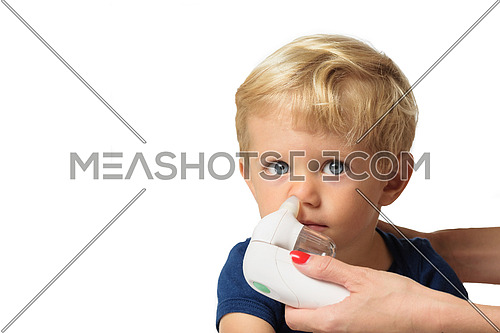 Mother using baby electric nasal aspirator. She is doing a mucus suction to twenty months baby boy,white backgrounds.
