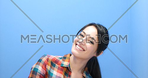 Beautiful face of young adult woman with clean fresh skin - studio portrait