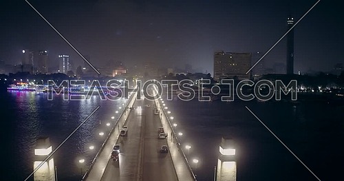Aerial shot from drone fly around Kasr Al Nile Bridge in Cairo at night