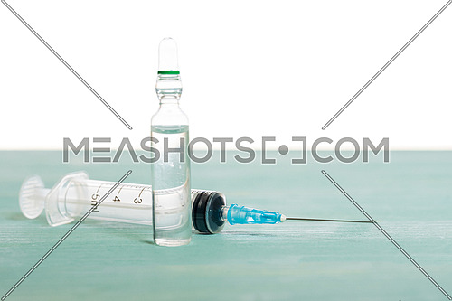 Medical vial and syringe isolated on white background, vaccination concept and disease treatments