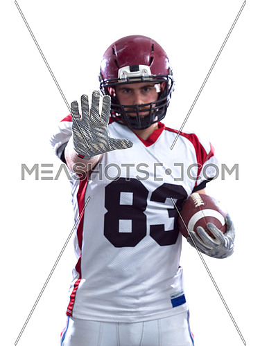 Portrait of American football player pointing against white background