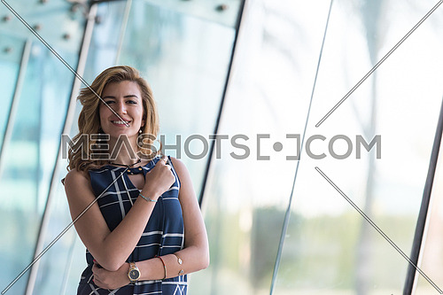 attractive middle eastern business woman portrait with travel bag at airport terminal