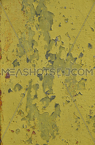 Stained corroded rusty yellow khaki painted metal surface with flakes and scratches