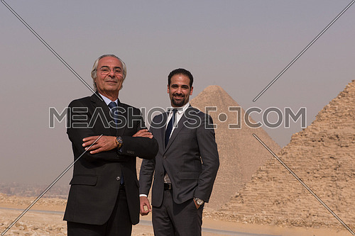 successful arab business people at Egyptian giza platou with pyramids in backgronud