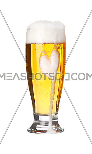 Close up one full high glass of lager beer with froth and bubbles isolated on white background, low angle side view