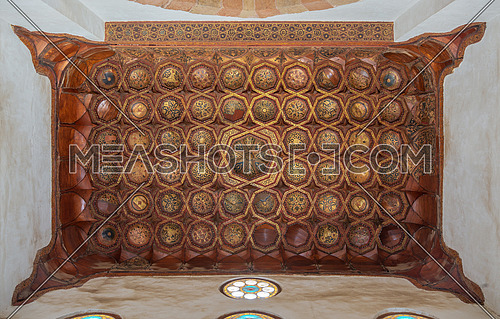 Ornate ceiling with golden floral pattern decorations at historic Bashtak Palace, located in Muizz Street, Gamalia district, Cairo, Egypt
