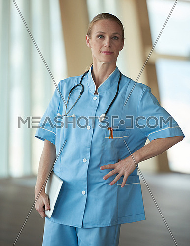 portrait of female doctor with  tablet computer at hospital