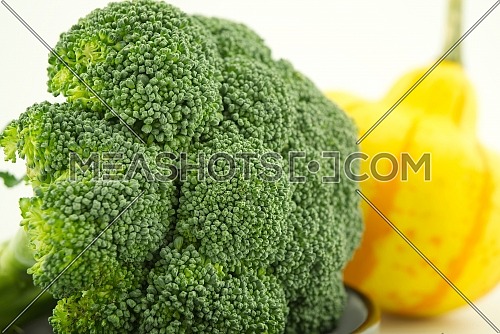 Fresh broccoli in close up on kitchen table, selective focus