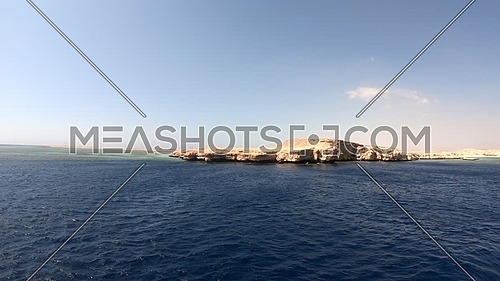Long shot from Red Sea showing Ras Muhammed Island at day