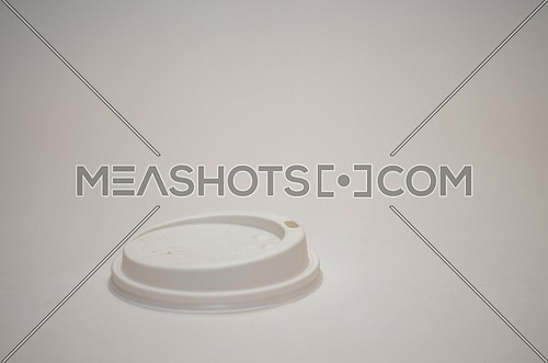 A white paper cup cover