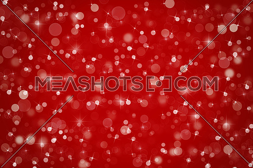 Abstract maroon red Christmas holiday winter background of falling snow bokeh, sparkles and glitter