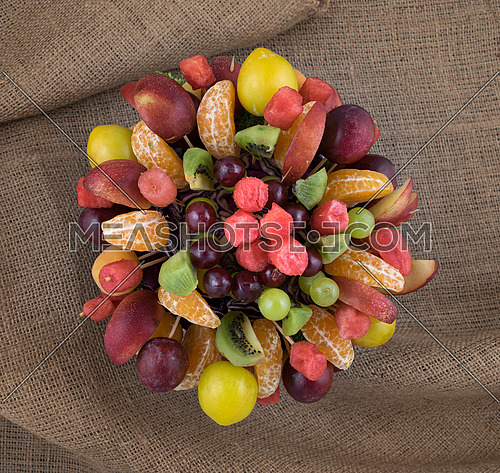 Studio shot of a fruits basket on sackcloth background