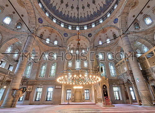 Interior low angle shot of Eyup Sultan Mosque situated in the Eyup district of Istanbul, Turkey, outside the city walls near the Golden Horn. The present building dates from the beginning of the 19th century