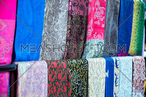 scarfs made of silk cloth hanged