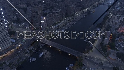 Flying over AL Galaa Bridge showing the River Nile, AL Galaa Square in Dokki Area in Cairo by early morning - 3rd of May 2022