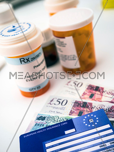 European health insurance card along with several capsules, concept of medical increase in the crisis of the brexit, conceptual image, horizontal comp