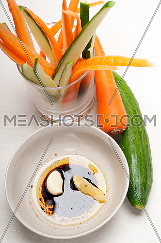 fresh raw carrot and cucumber with pinzimonio sauce italian snack appetizer
