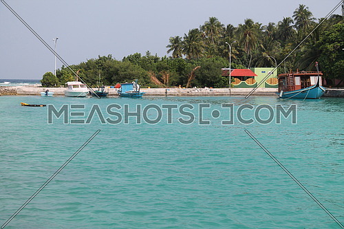 Boats docked on a Maldives island