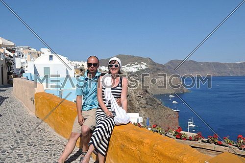 young couple portrait in love have romantic time on summer vacation holidays in greece santorini