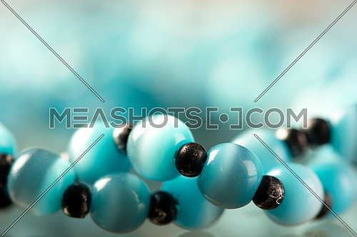 Blue Rosary beads with a macro lens