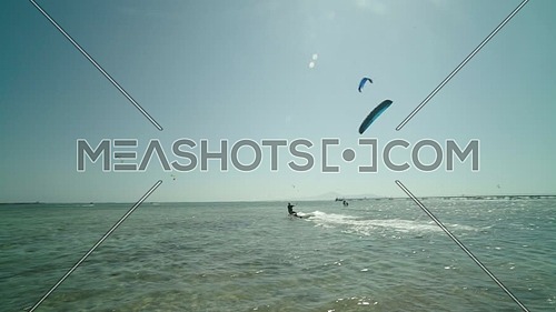 Follow shot for kite surfers in Sharm el shaikh at day