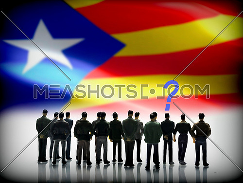 Several men looking at the flag of Catalonia, conceptual image