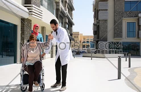 doctor and nurse with elderly person hospital care concept