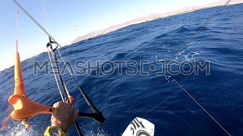 POV shot for Kite Surfer while surfing in Red Sea at day.