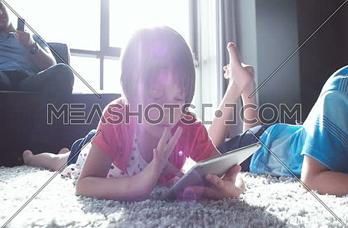 kids playing on floor of modern apartment