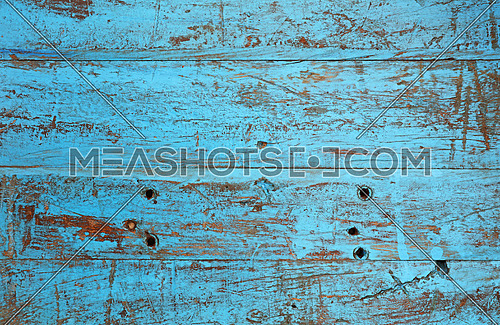 Grunge background texture of blue painted brown wood with dirty stains, scratches, wholes and cracks