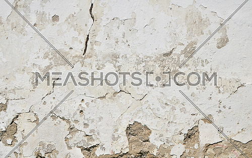Background texture of old dirty white painted plaster wall with cracks, gaps and grunge stains
