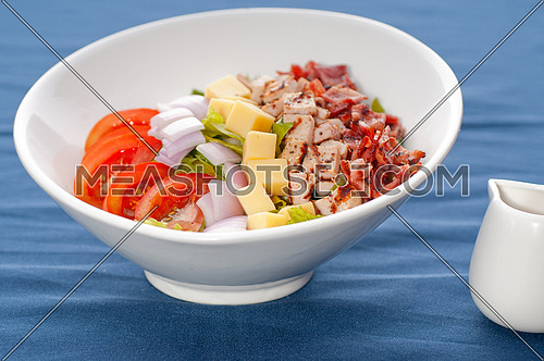 fresh classic caesar salad  over blue tablecloth close up,healthy meal ,MORE DELICIOUS FOOD ON PORTFOLIO