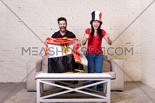 couple sitting on a couch at home