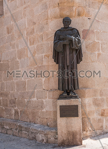 Caceres, Spain - july 13, 2018: Monument to San Pedro de Alcantara, made in 1954, located in the Plaza de Santa Maria, annexed to the church, Caceres, Spain
